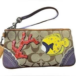 Coach limited edition rare fish wristlet GUC purple accent and interior